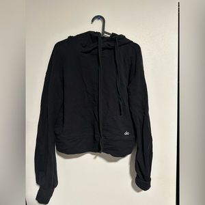 Black Alo sweater great for workout out or enjoying a brisk walk.